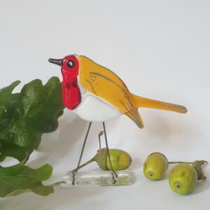 Glass robin named Rupert. Standing bird with wire legs. Red, amber and white with sturdy clear glass base stand.